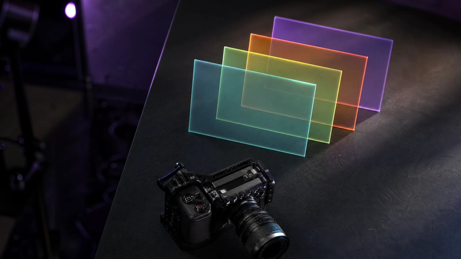 Four stacked prompt cards above a camera icon on a dark desk